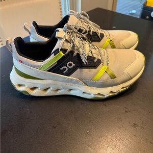 On Running Athletic Shoes in Cream, Black, and Green